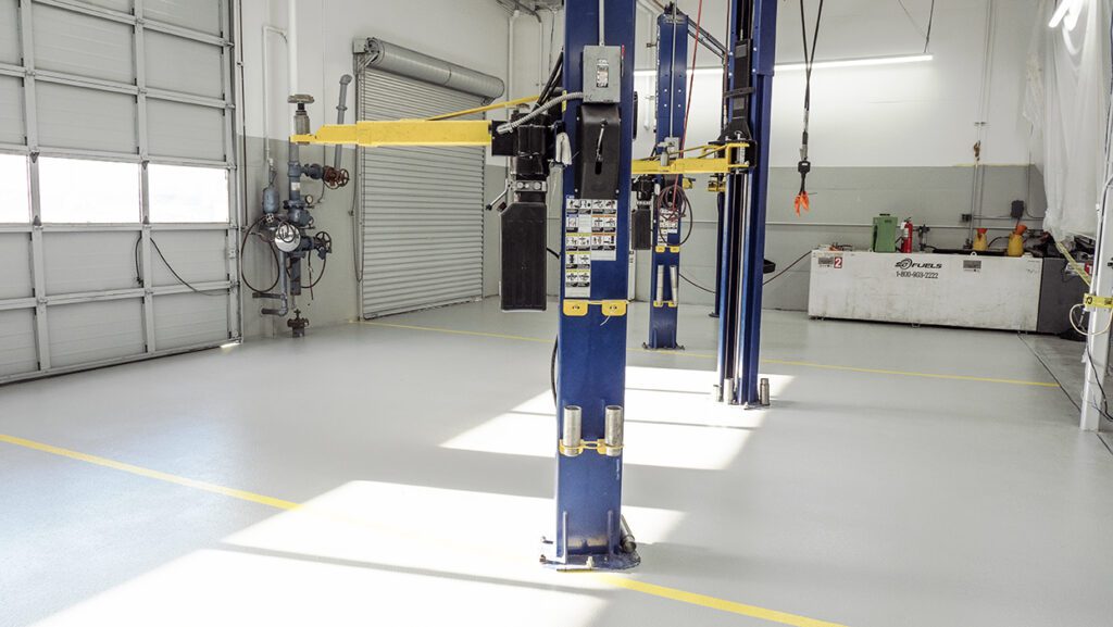 Polyurethane industrial floor coating applied in an auto service bay