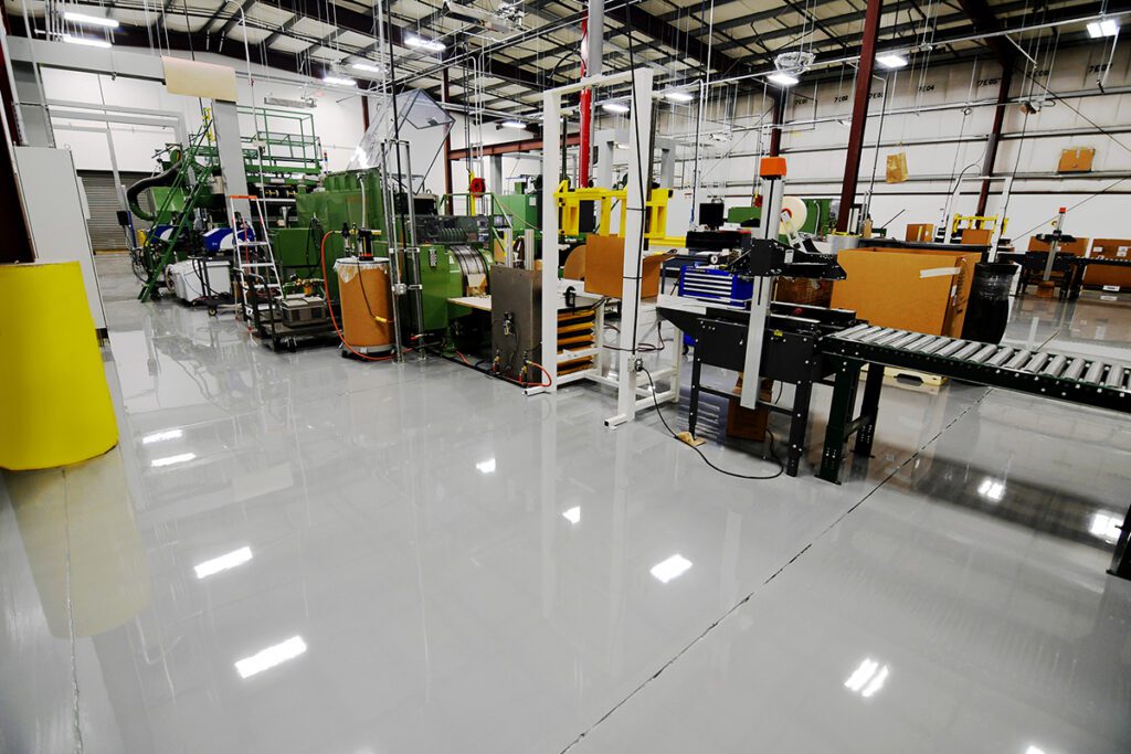 Industrial floor coating installed in a warehouse production facility